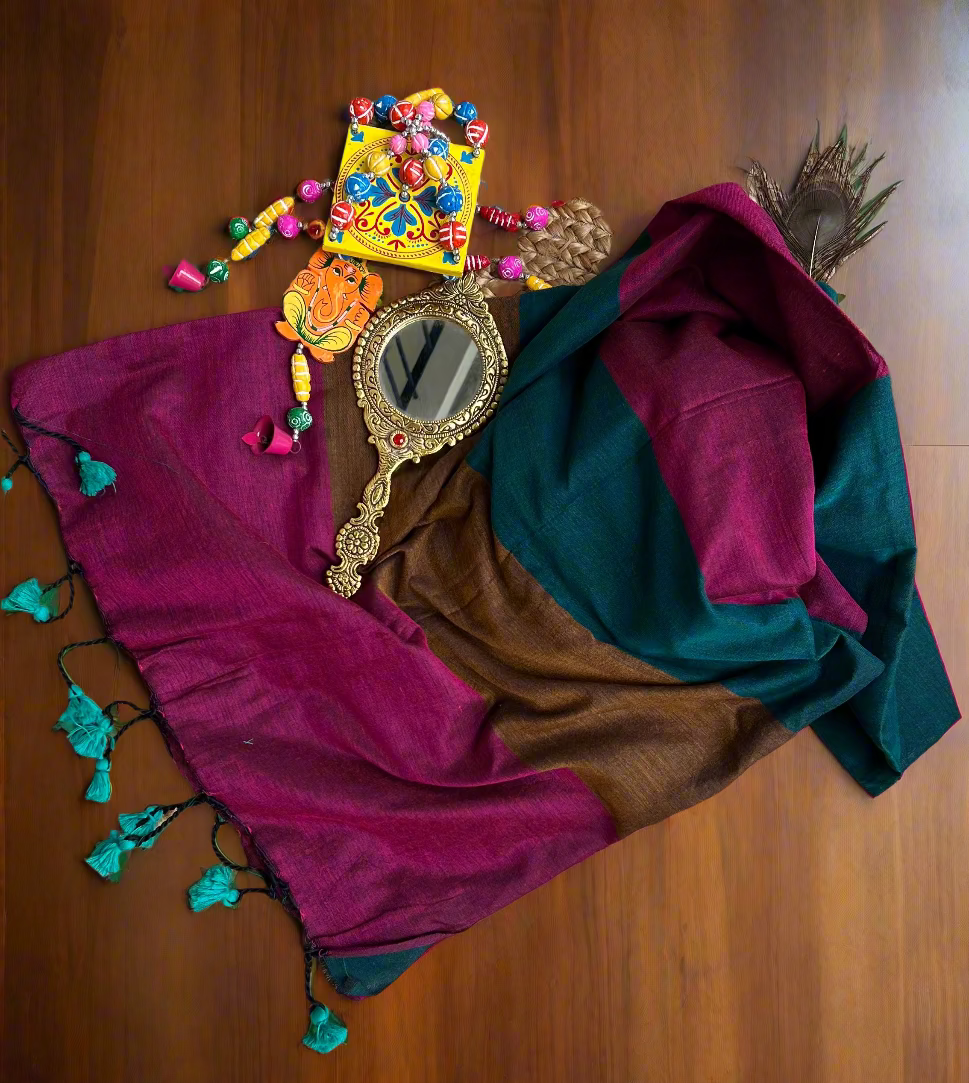 Colorful scarf with decorative mirror and beads on a woven mat