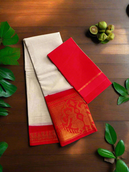 Two sarees, one red and one beige with a red border, on a woven mat.