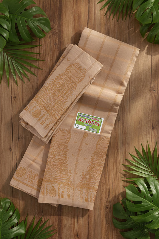 A folded beige cotton saree with gold zari embroidery and a small green and white 'Sungudi' brand label, displayed on a woven straw mat.