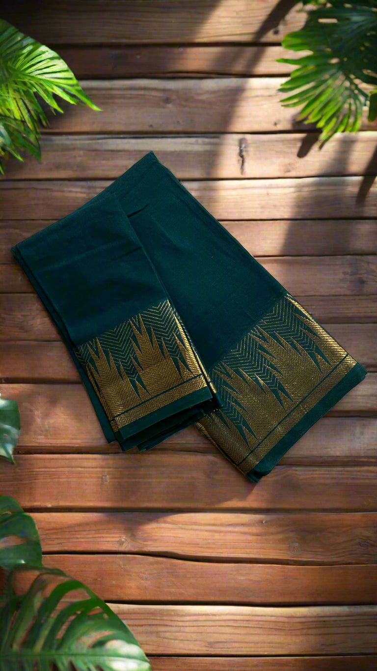 Green fabric with gold patterns on a woven mat