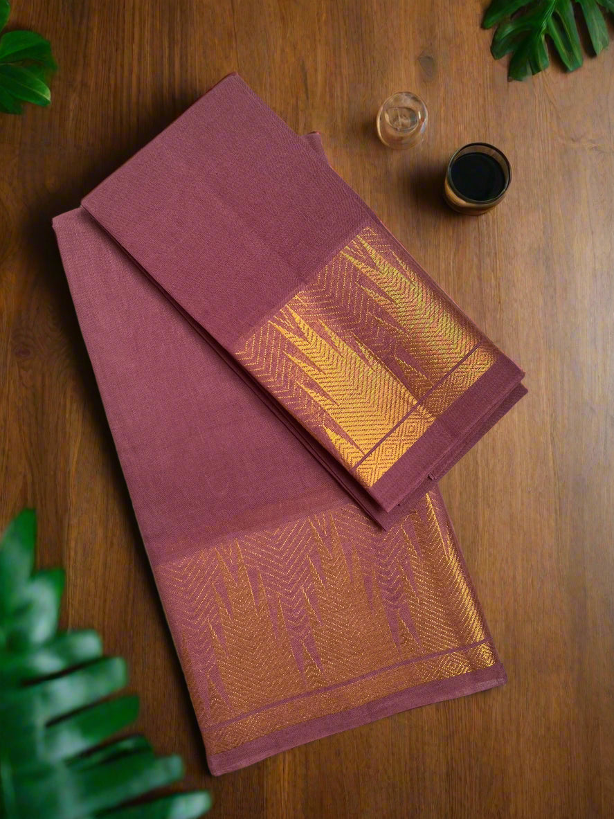 Maroon and orange saree with a geometric pattern on a wooden surface