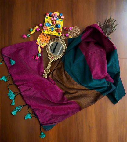 Colorful scarf with decorative mirror and beads on a woven mat