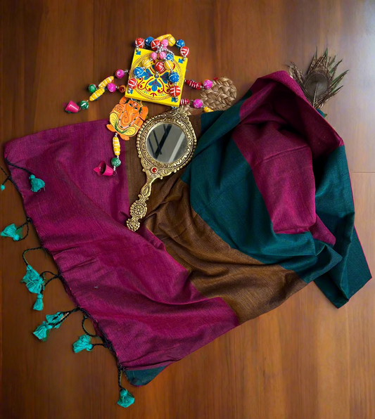 Colorful scarf with decorative mirror and beads on a woven mat