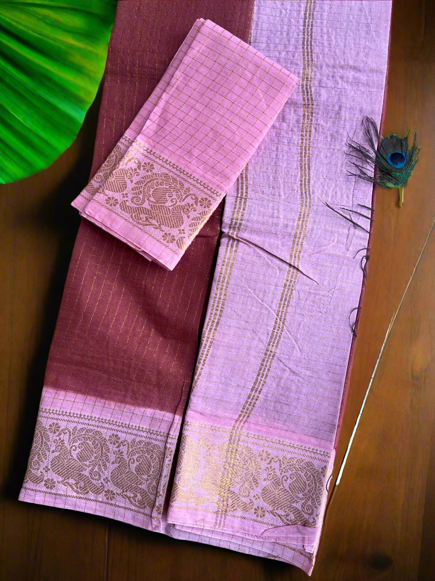 Purple saree with pink border on a textured surface