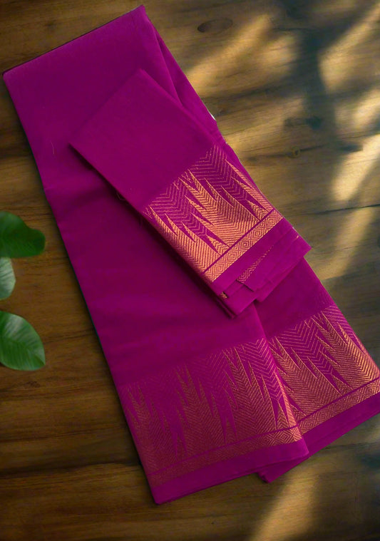 Purple saree with gold border on a white surface