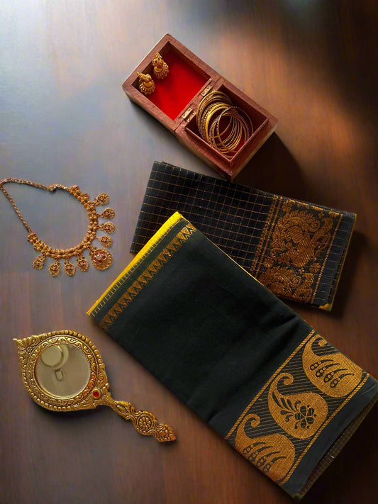Jewelry set including necklace, bangles, and mirror on a white fabric background