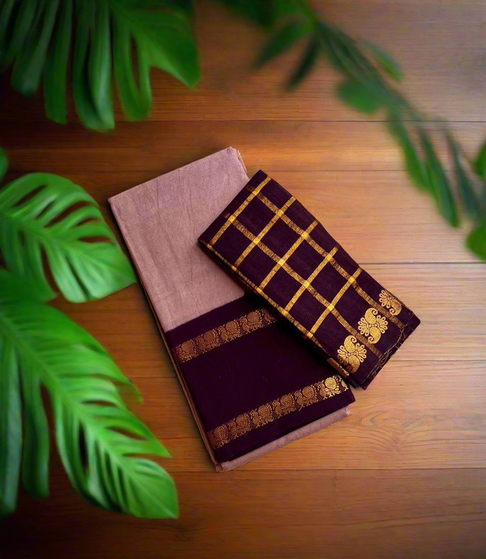 Two folded cloths, one purple and one with a gold checkered pattern, on a woven mat.