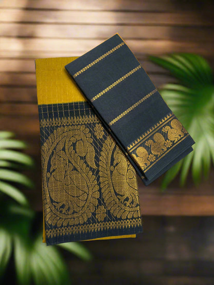 Black and yellow saree with intricate patterns on a wooden surface