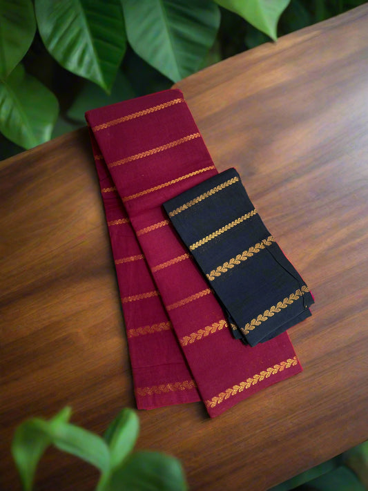 Two folded fabrics with gold stripes on a woven mat